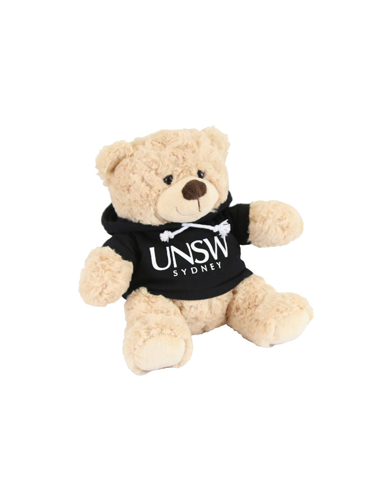 A plush bear wearing a hoodie with a UNSW logo - black